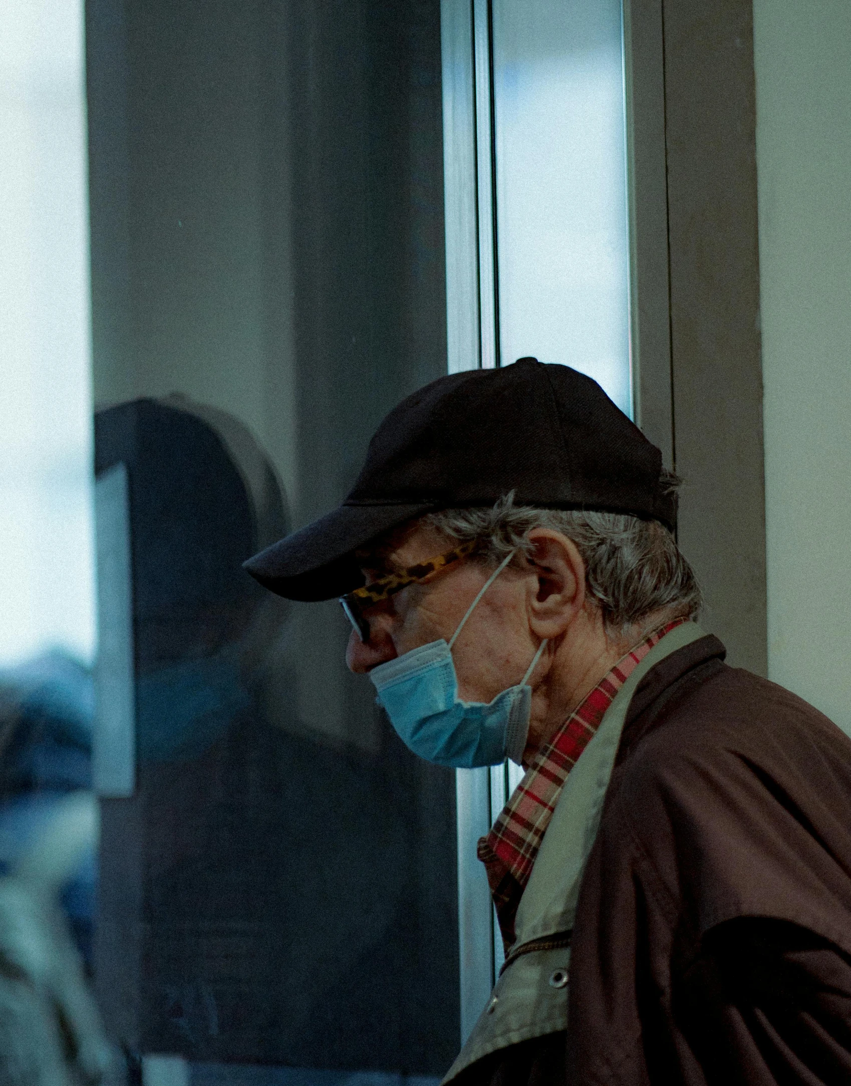 a man with glasses and a face mask on