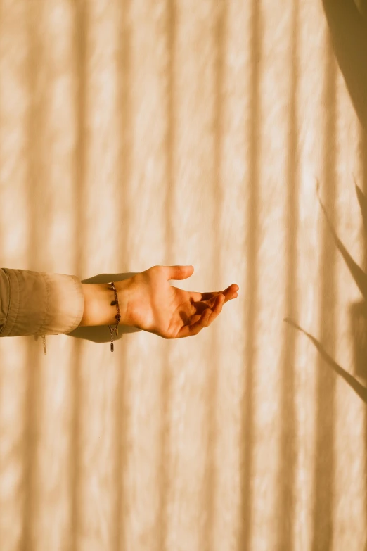 a hand reaching upward towards the camera