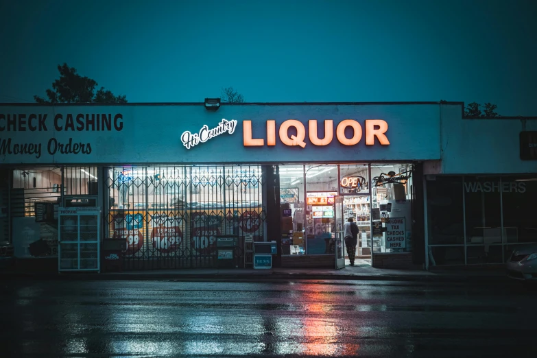 a liquor store with its doors open in the rain