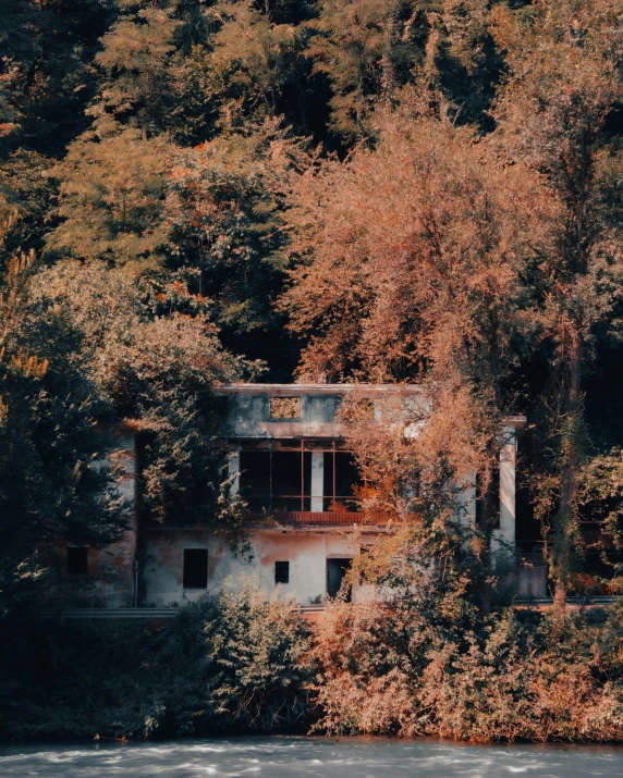 a very old building sitting next to a large body of water