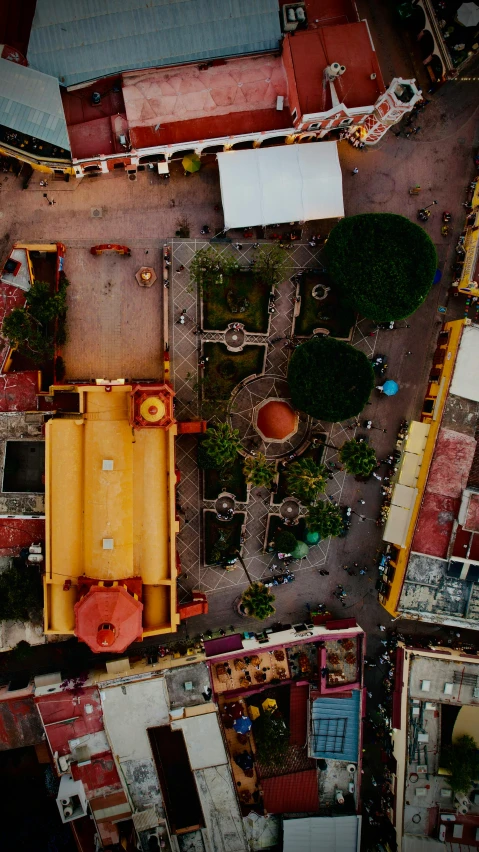 a city street seen from above looking down at several different buildings