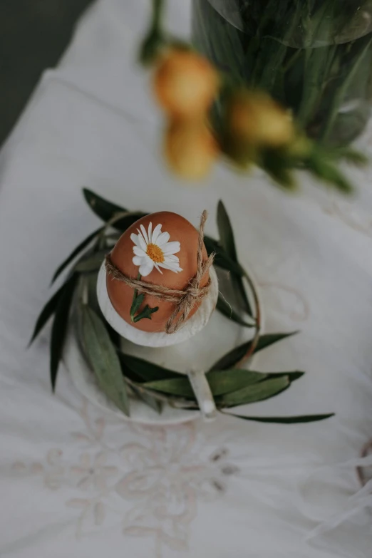 some flowers are on a table with a white plate