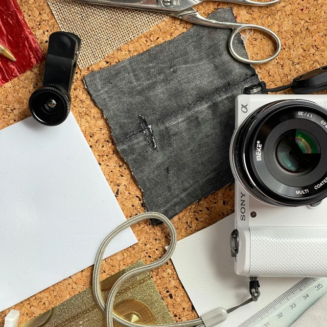 a camera and some tools on top of a table