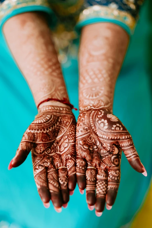 a close up of someone's hands, hendi or hand tattoo