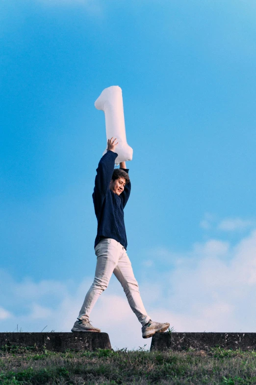 a man holding a large paper bag on top of his head