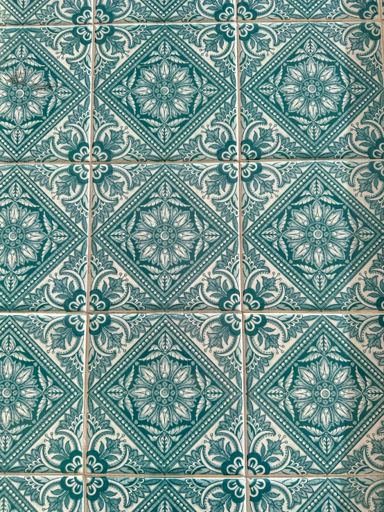 a close up of an old tile floor