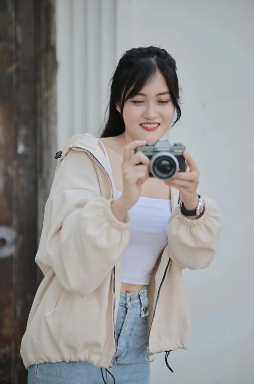 a girl taking a selfie with her camera