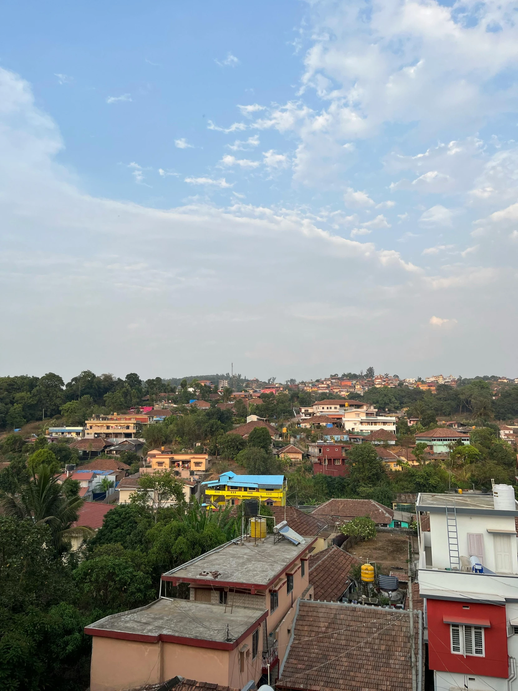 a view of buildings and the sky from above