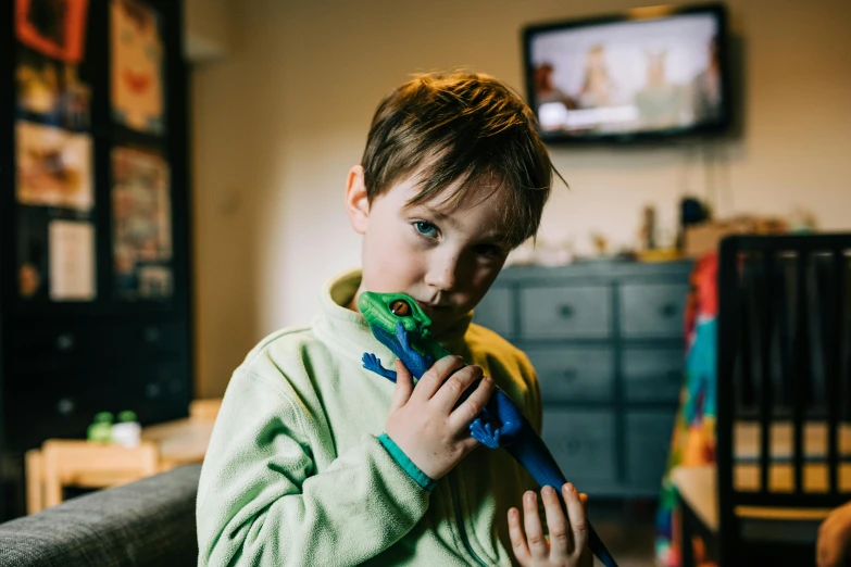 a  is playing with toys in a room