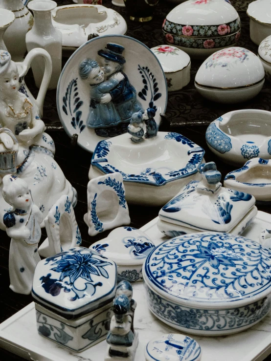 a collection of blue and white pottery on display