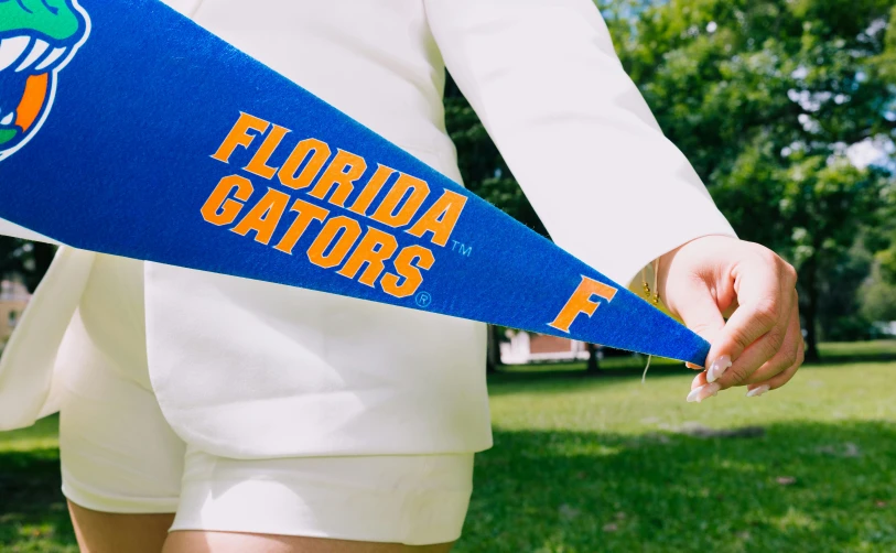 an image of a man wearing a florida state pennant