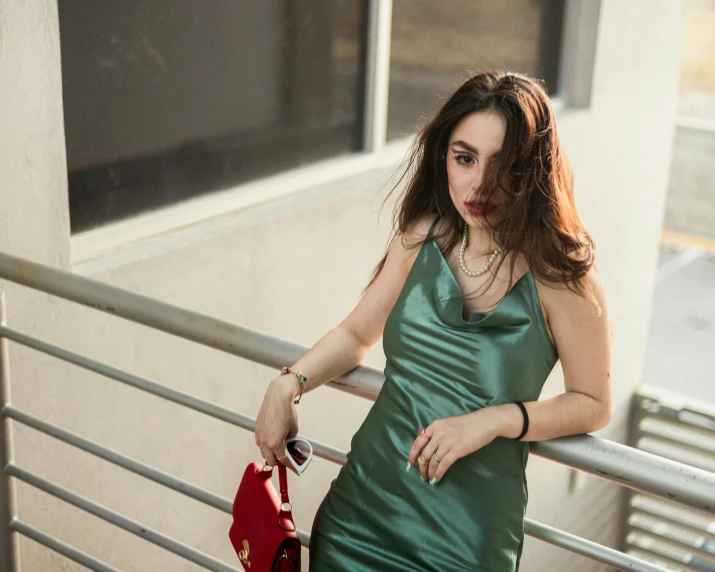 a young woman standing on the deck of a building