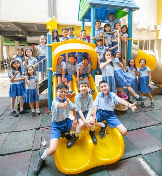 some s are sitting on a playground swing