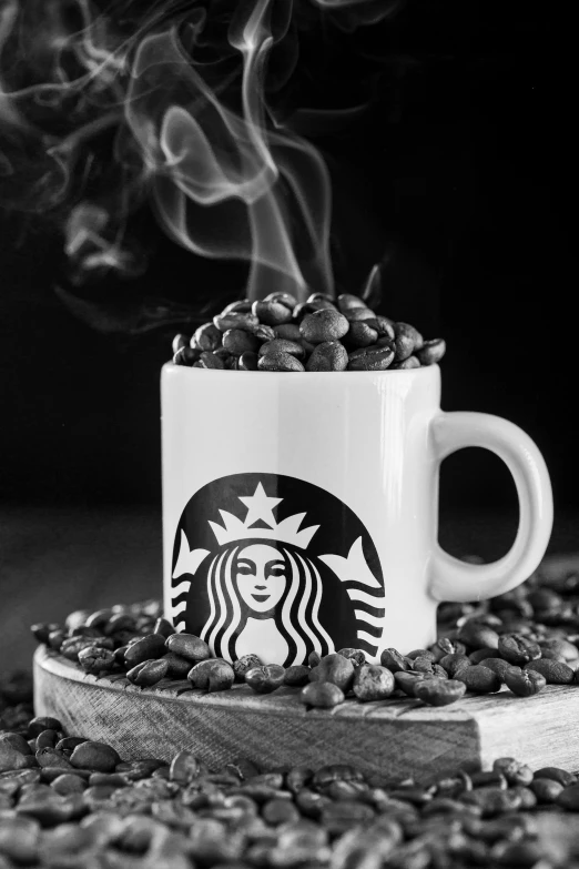 starbucks cup on a tray of coffee beans