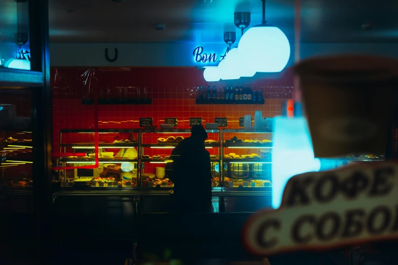 the silhouette of a person at a restaurant