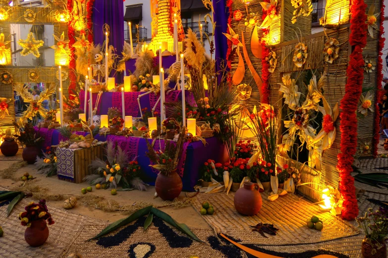 an outdoor room with lots of decorated candles and decorations