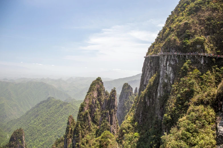 a scenic overlook of the mountains and greenery