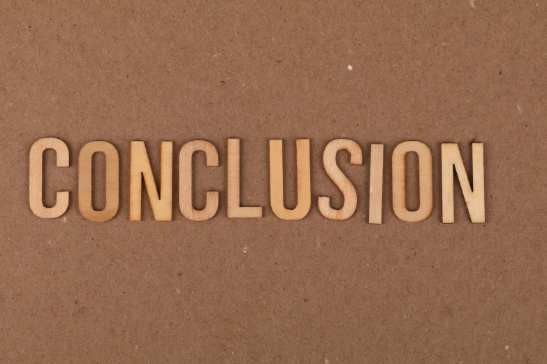 a word carved into wood with the word conclusion written