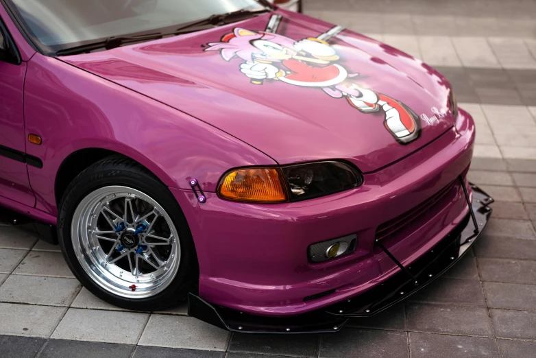 the purple car is decorated with an anime image