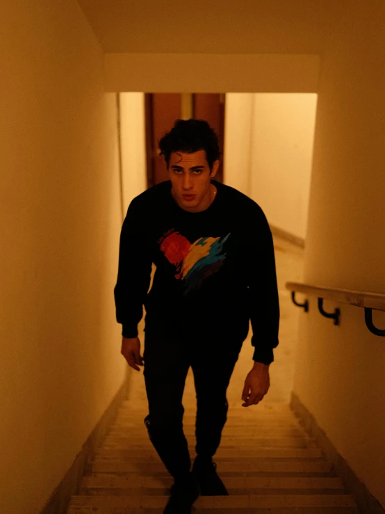 a man walking down a hallway in an overpass