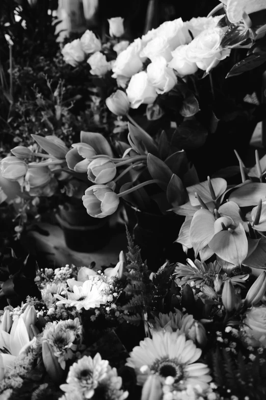 flowers for sale and a pot in the background