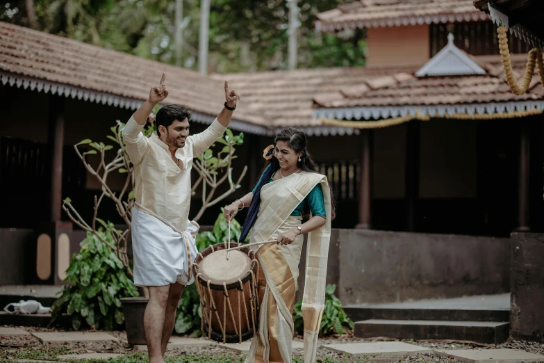 this is a couple dressed in traditional indian clothing