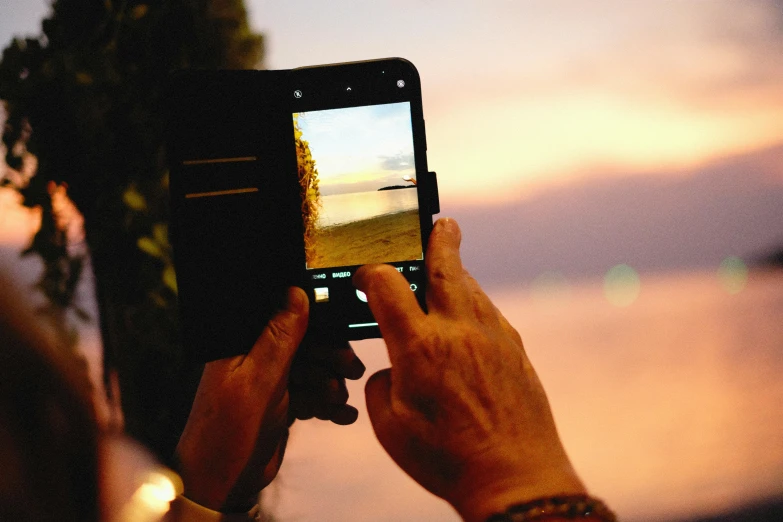 a person taking a po of the water with a camera