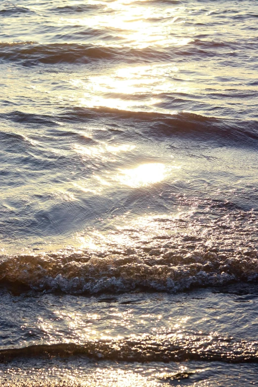 a person sitting on top of a surfboard in the water