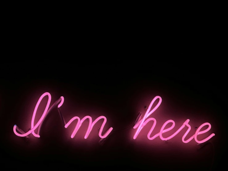 pink text and dark background saying i'm here