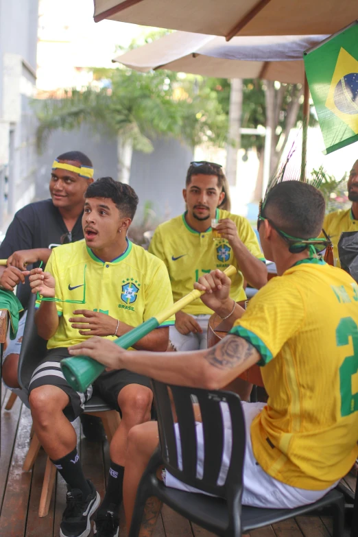 people with flags, sitting in a group