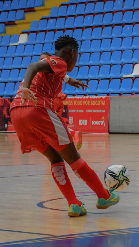 a man is on the basketball court playing with a ball