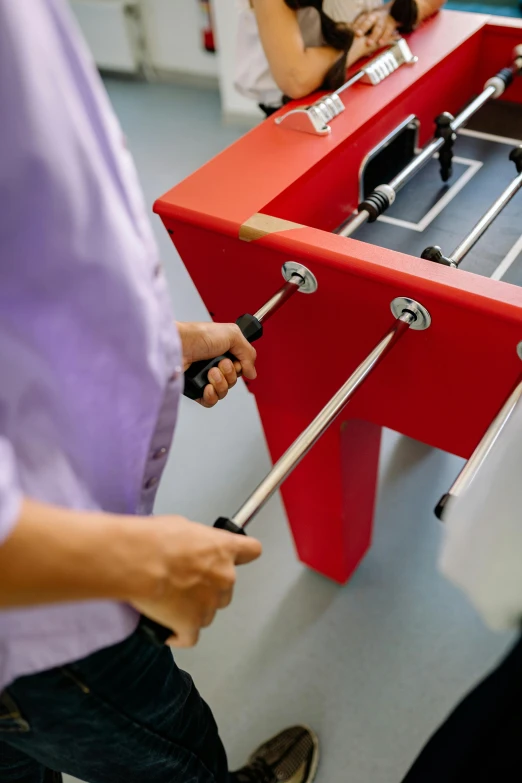 a woman that is using a giant tool to fix an object