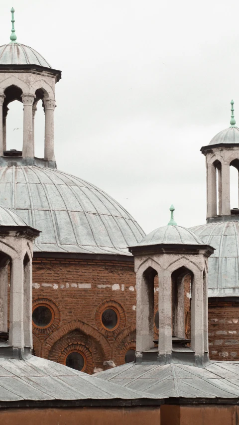 an old church with two clocks on it's towers