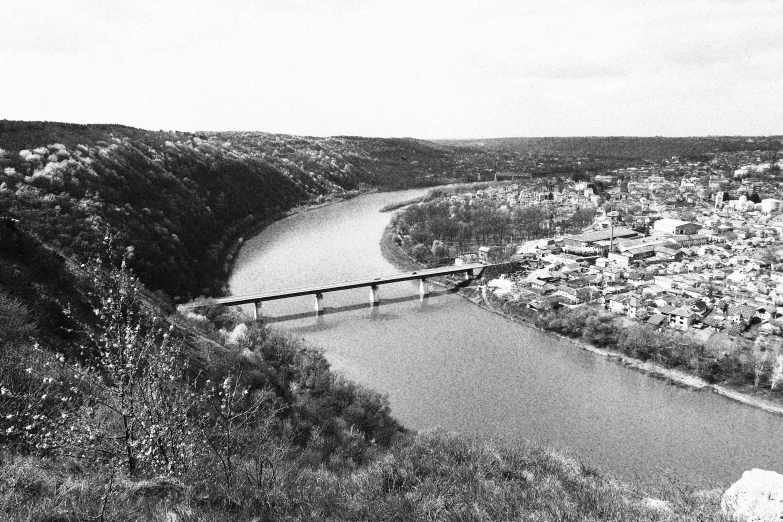 a city near a river in a black and white scene