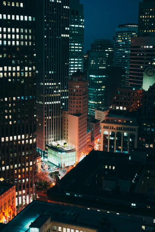 an elevated view of skyscrs at night