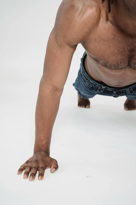 man with  bending over wearing a pair of jeans