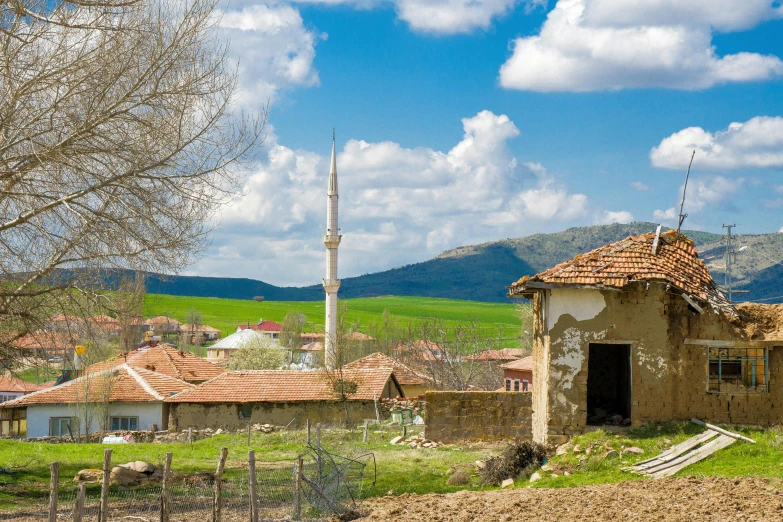 an old village in a valley is near mountains