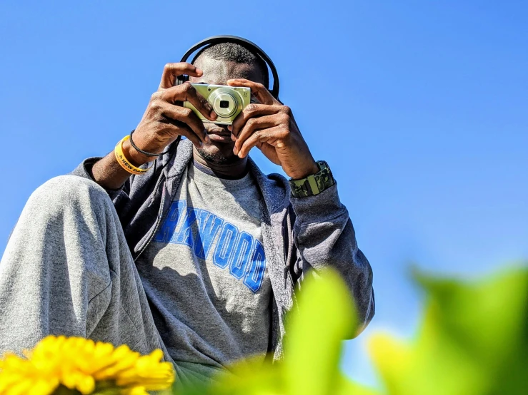 a man is taking a picture in the middle of the field