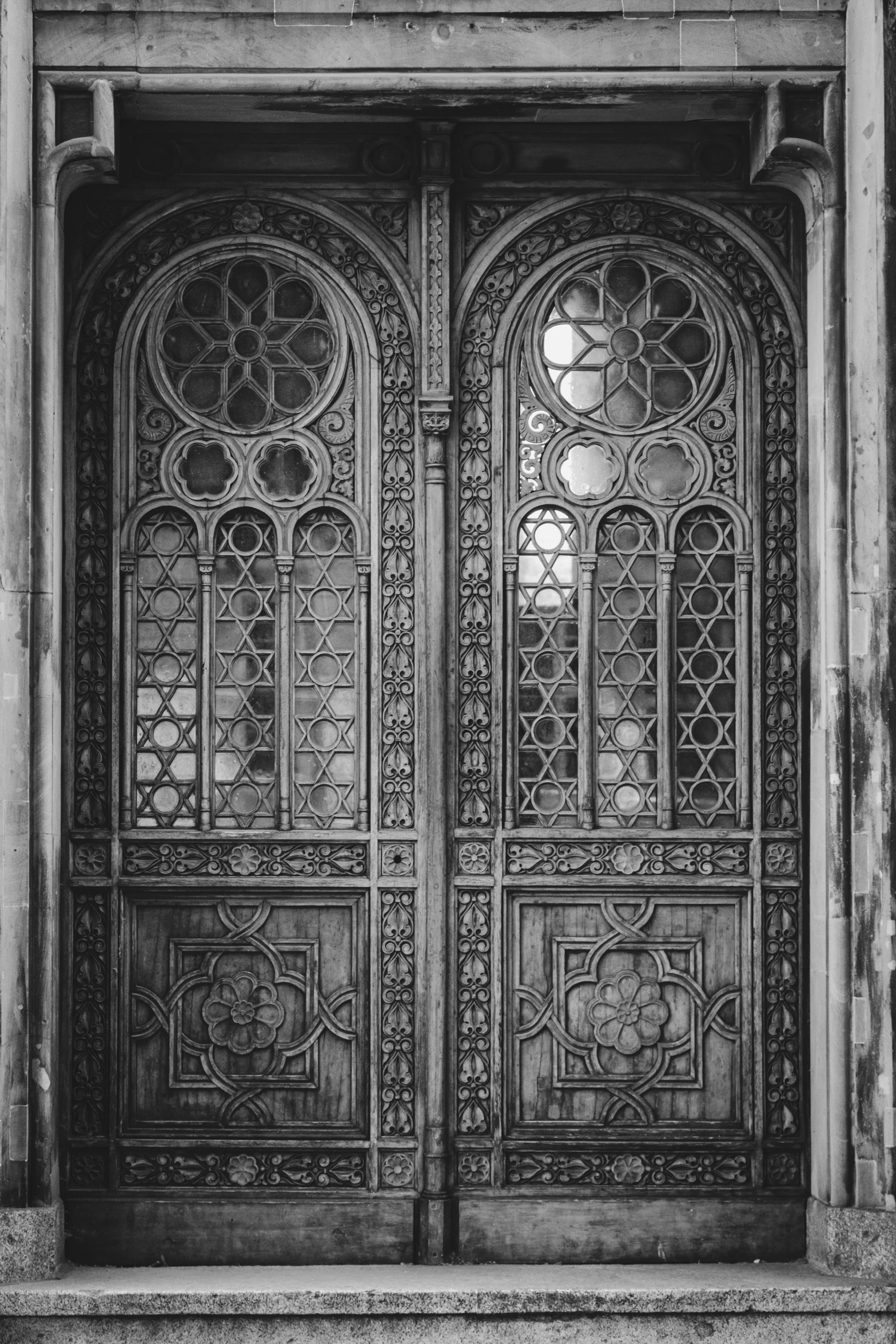 an old doorway is decorated with intricate ironwork