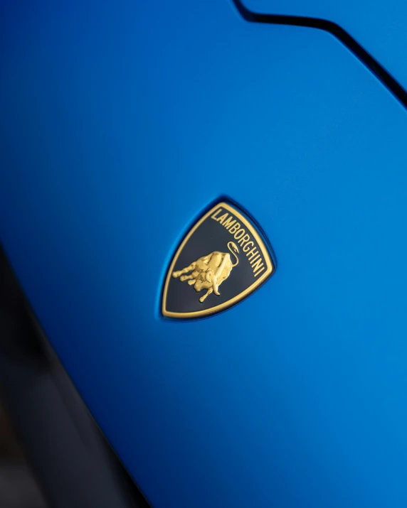 a badge of the blue ferrari logo is pictured