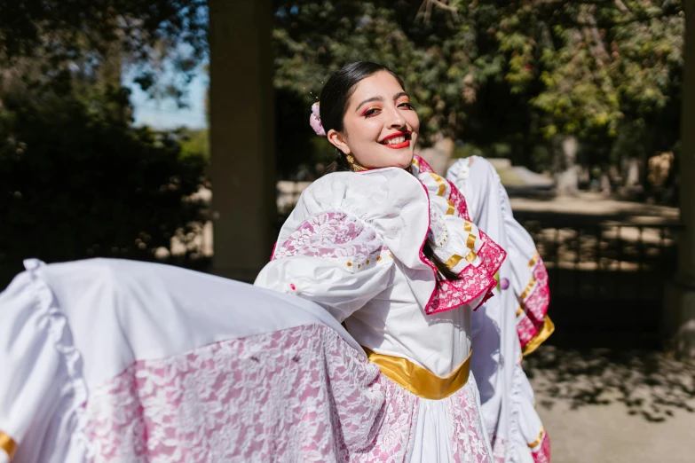 a woman in traditional garb posing for a po