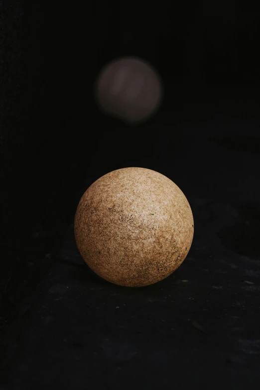 a round orange sitting on top of a table