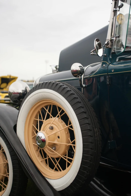 the front of a brown and white antique automobile