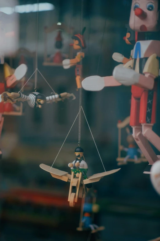 an assortment of wooden toys are displayed