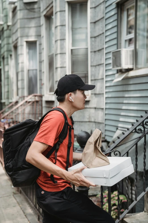 a man is holding an un - opened shoe box