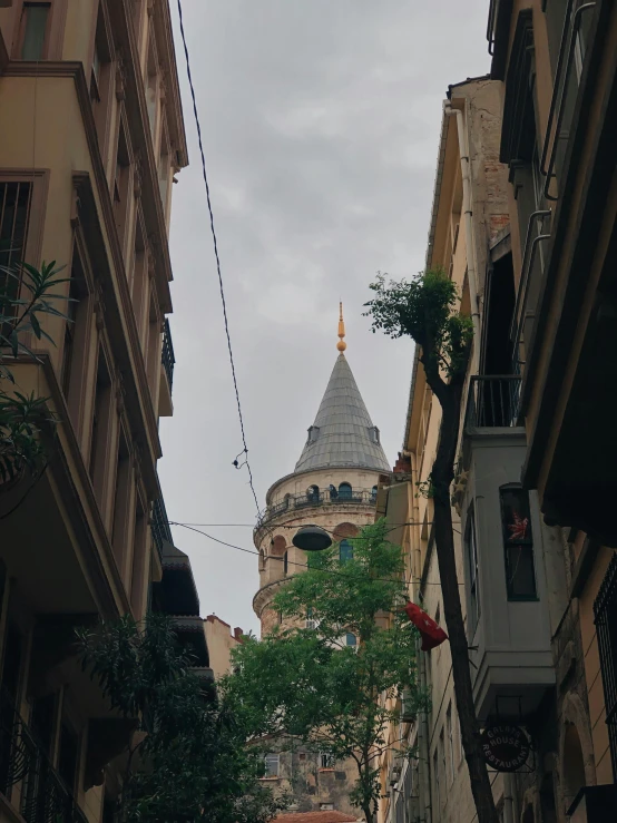 some buildings with an old church in the back