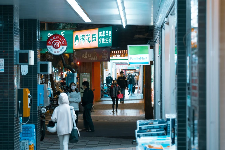 a city street at night during the day, with people walking