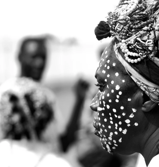 the two women are dressed in tribal head scarves