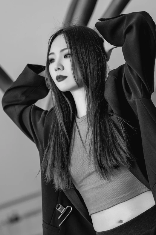 a woman is posing for a picture with her hands on her head