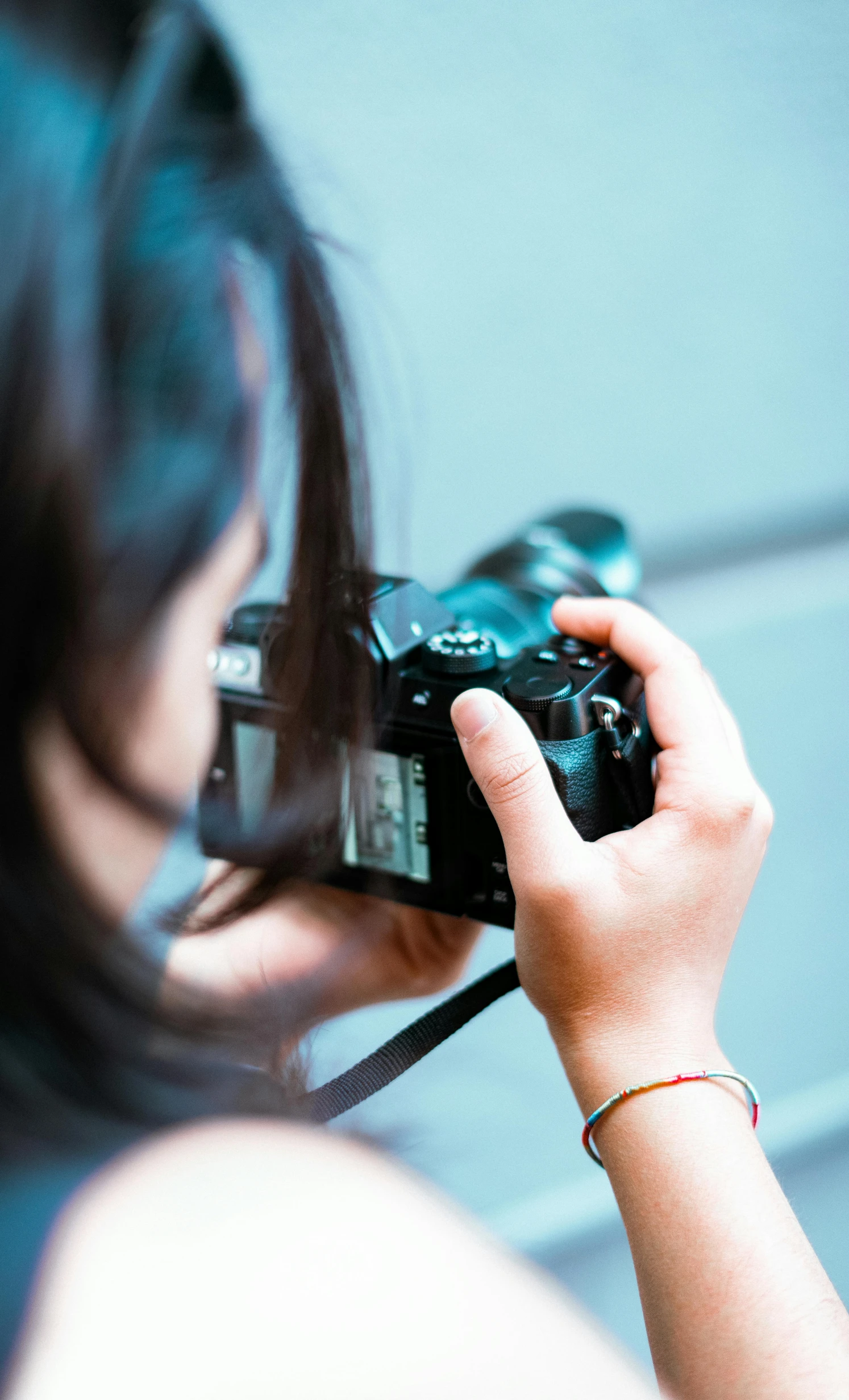 a woman taking a picture of her camera